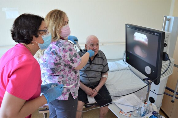 Teacher.  Gytė Damulevičienė (left) with a doctor Margarita Rugaitiene examines the patient's swallowing processes with a video endoscope