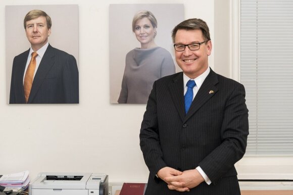 Ambassador Van der Lingen in his Vilnius office with royal portraits by Rineke Dijkstra Photo Ludo Segers